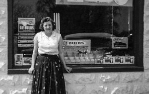 Mrs Logan in front of office on Pellan Street